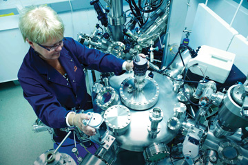 woman working with nuclear technology equipment