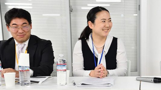 man and woman seated at table at event