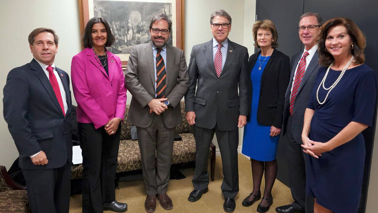 Chuck Fleischmann, Rita Baranwal, Julian Gadano, Rick Perry, Lisa Murkowski, and Suzie Jaworowski, standing for a photo.